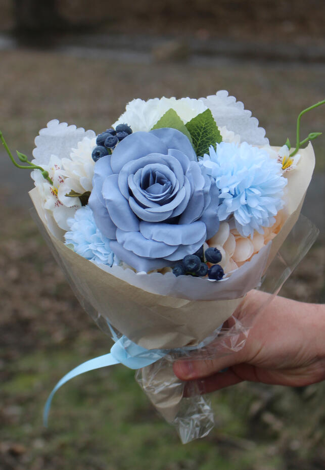 Bright coloured silk bouquet with roses, ranunculus, anemone, hibiscus and wisteria.