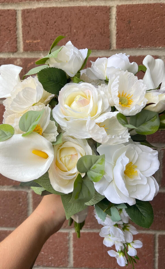 White silk bouquet with calla lilies, peonies, roses, and anemone.