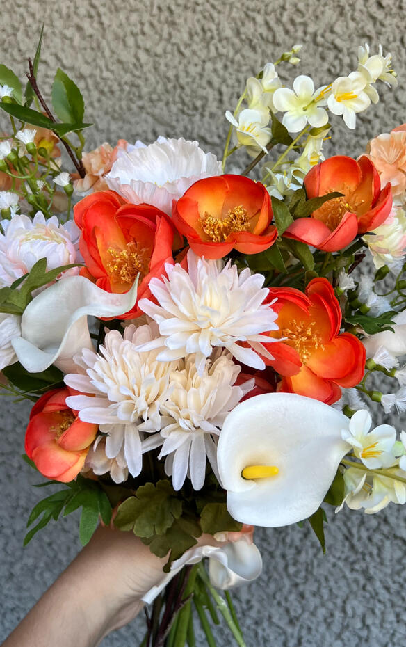 Bright coloured silk bouquet with roses, ranunculus, anemone, hibiscus and wisteria.
