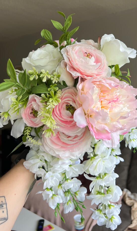Pink and white silk bouquet with peonies, roses, ranunculus and wisteria.
