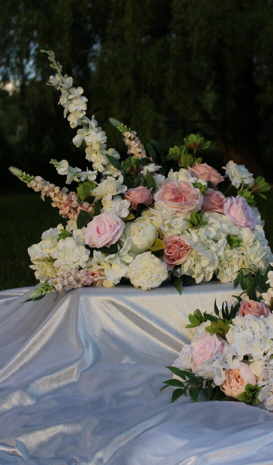 White silk bouquet with calla lilies, peonies, roses, and anemone.